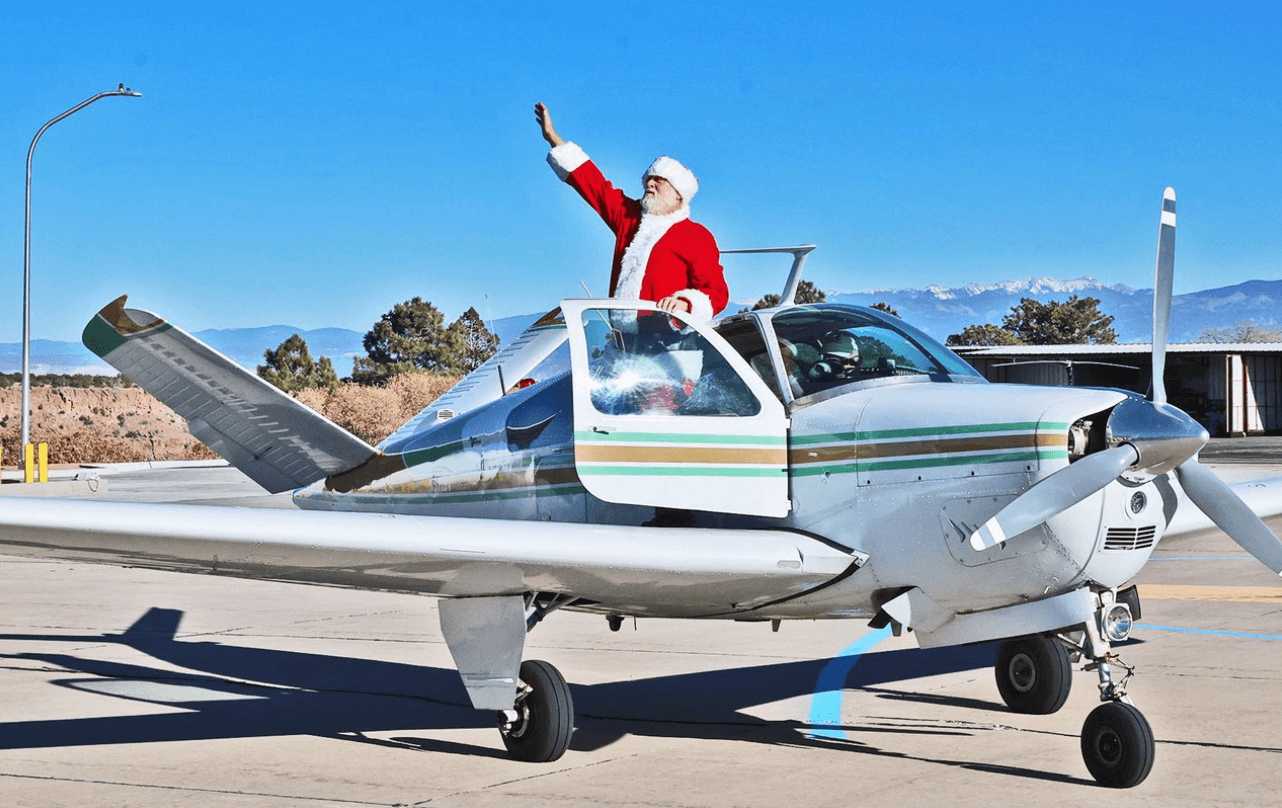 Santa Arrives By Airplane at Los Alamos Airport December 20
