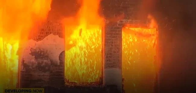 Large Fire Gutting China Alley Building Raises Safety and Policy Questions